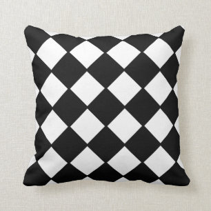 Coussin noir et blanc de décorateur de damier