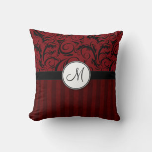 Coussin Noir sur les mèches et les rayures florales rouges