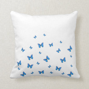 COUSSIN PAPILLONS DE BLEUS LAYETTE SUR LE BLANC