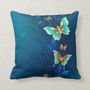 Coussin Papillons d'or sur un Arrière - plan bleu