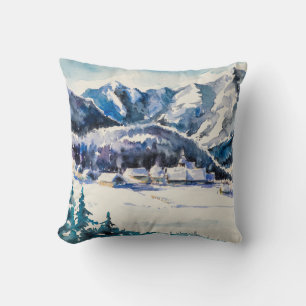 Coussin Paysage d'hiver avec village de montagne couvert