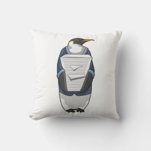 Coussin Penguin comme secrétaire avec pile de papier