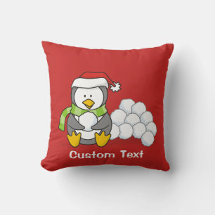 Coussin Pingouin de Noël assis avec des boules de neige