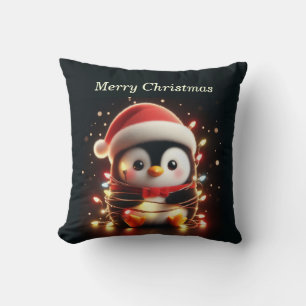 Coussin Pingouin mignon enveloppé dans les lumières de Noë