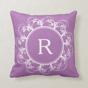 Coussin pourpre de monogramme floral de remous