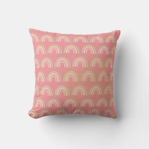Coussin Rainbows sur un arrière - plan rose