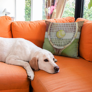 Coussin Raquette de tennis avec balle posée sur le court