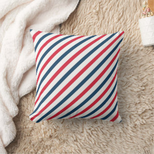 Coussin rayé bleu, rouge et blanc