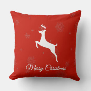 Coussin Renne blanc classique et Joyeux Noël sur fond roug