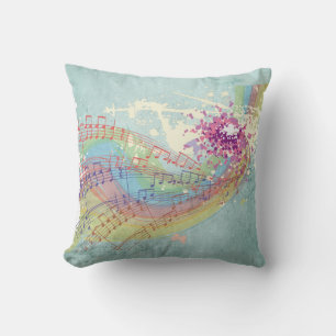 Coussin Retro Arc en ciel et notes musicales sur une textu