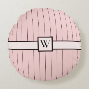 Coussin rond rose avec rayures noires