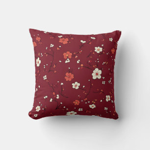 Coussin rouge foncé aux minuscules fleurs blanches
