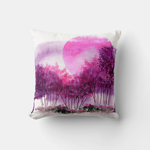 Coussin silhouette rose et violette des arbres contre le d