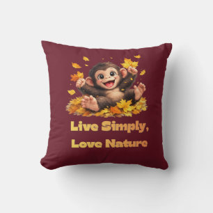 Coussin Singe mignon heureux jouant dans les feuilles d'au