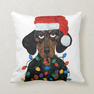 Coussin Teckel Père Noël embrouillé dans des lumières 