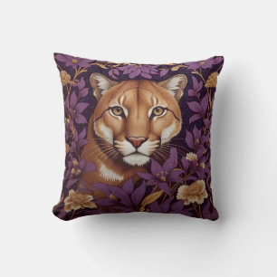 Coussin Tête de couguar parmi un feuillage et des fleurs d