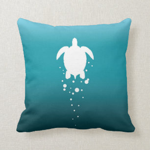 Coussin Tortue et bulles de mer contre l'océan bleu-vert