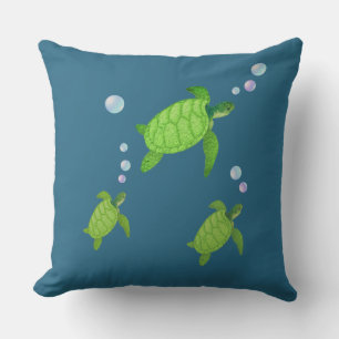 Coussin Tortues de mer vertes sur fond bleu