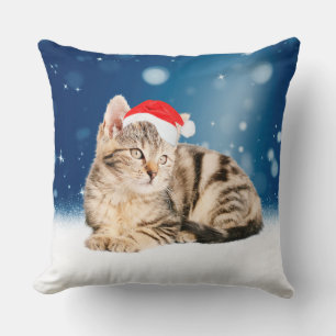 Coussin Un chat mignon portant un chapeau de Père Noël rou