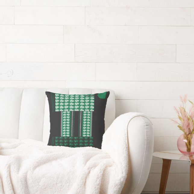 Coussin un motif vert et noir avec un arbre au milieu (Canapé)
