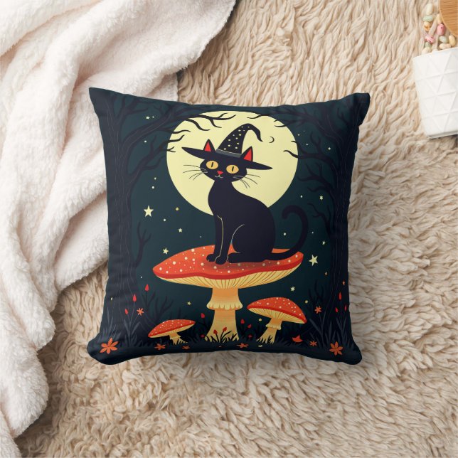 Coussin  Une petite chatte noire de sorcière assise sur un (Couverture)