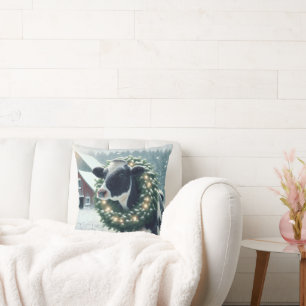 Coussin Vache portant une couronne de Noël éclairée