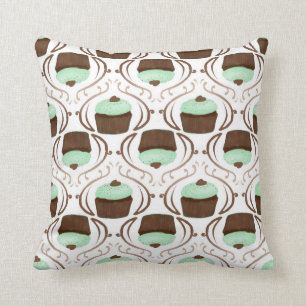Coussin vert en bon état de petit gâteau de