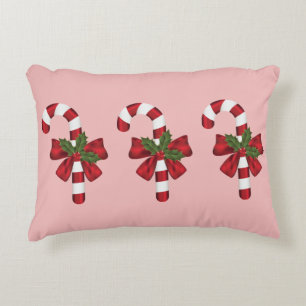 Coussins Décoratifs Trois cannes de Noël sur fond rose clair