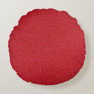 Coussins Ronds Closeup en cuir artificiel rouge foncé.