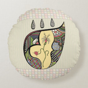 Coussins Ronds Un oreiller rond avec une fleur à l'intérieur