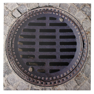 Couverture de trou d'homme et carreau de céramiqu