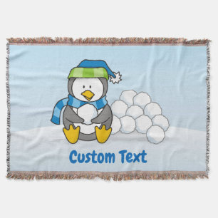 Couverture Petit pingouin assis avec des boules de neige jett