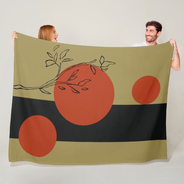 Couverture Polaire cercles noirs et orange motif géométrique (En situation)