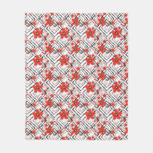 Couverture Polaire Fleurs rouges sur fond blanc et noir.