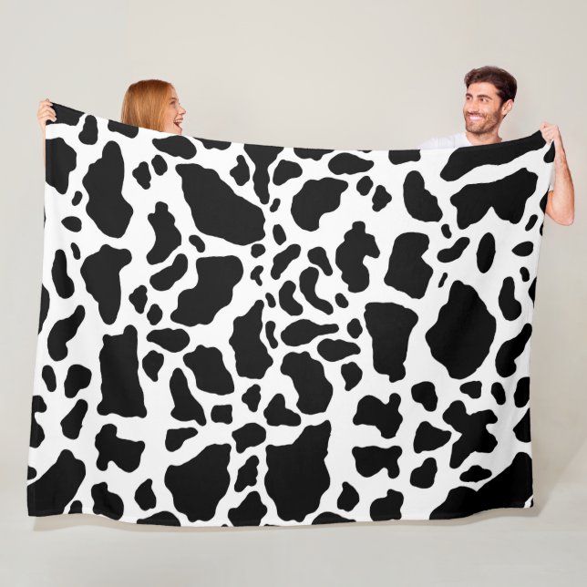 Couverture Polaire Impression de vache noire et blanche (En situation)