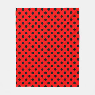 Couverture Polaire Motif à pois noirs sur fond rouge