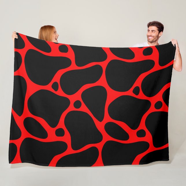 Couverture Polaire Motif de girafe abstraite rouge et noire (En situation)
