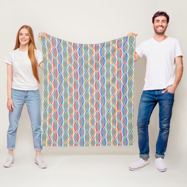 Couverture Polaire Motif géométrique coloré. (En situation)