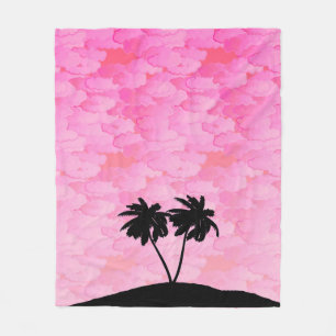 Couverture Polaire Silhouette de palmier contre l'aube rose avec nuag