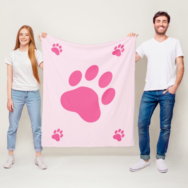 Couverture Polaire Silhouettes de patte de chien rose (En situation)