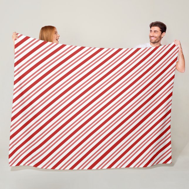 Couverture Polaire Sucre de canne rouge et blanc (En situation)