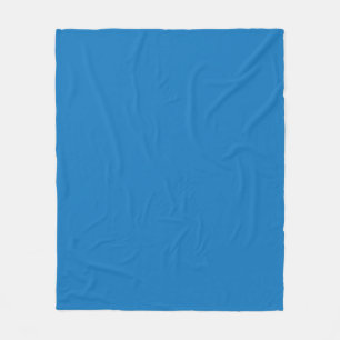 Couverture Polaire un arrière - plan bleu avec une horloge noire et b