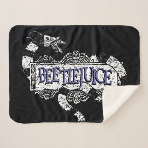 Couverture Sherpa Beetlejus   Vapeur de sable enroulé sur le logo B