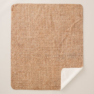 Couverture Sherpa Brown burlap posé sur une feuille blanche. dossie