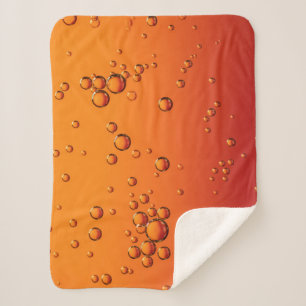 Couverture Sherpa gouttelettes d'eau sur la surface orange