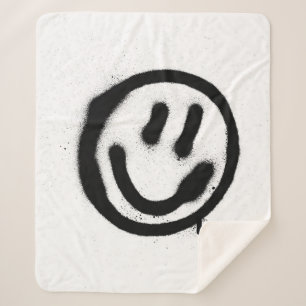 Couverture Sherpa graffiti visage souriant émoticon en noir sur blan