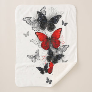 Couverture Sherpa Papillons noirs et rouges volants
