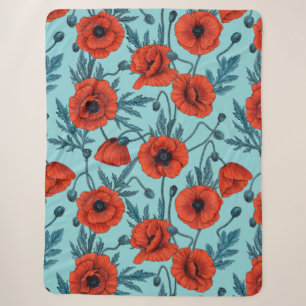 Couverture Sherpa Poppies, rouge et bleu sur le bleu de la piscine