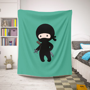 Couverture Sherpa Tiny Ninja tenant l'étoile au lancer sur le vert f