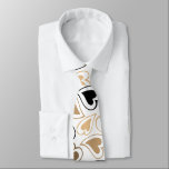 Cravate Modern Gold and Black Hearts Pattern<br><div class="desc">This unique tie has a pattern of modern heart images in tones of gold,  gold brown,  and black. The pattern is printed on a white background. Perfect for Valentine's Day,  but attractive for all year long.</div>